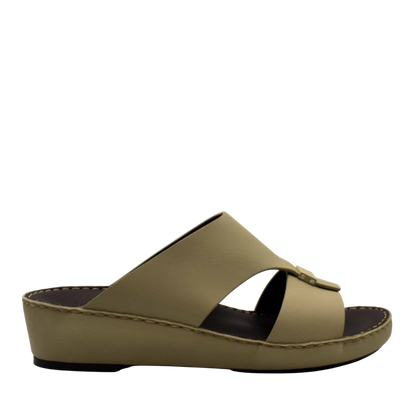 Side view of beige Cerchio Gomato sandals with a wedge sole and crossed straps