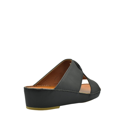 Black leather Peninsula Taglio sandals with wedge heel and open toe design from Private collection