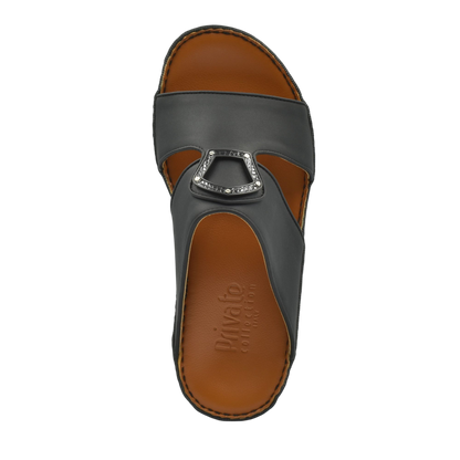 Black Peninsula Taglio sandals with decorative buckle and brown cushioned footbed from Private Collection