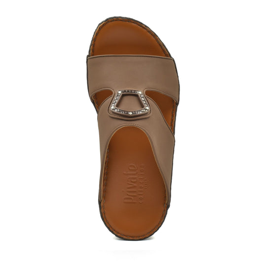 Top view of a brown Peninsula Taglio sandals with decorative buckle and cushioned footbed
