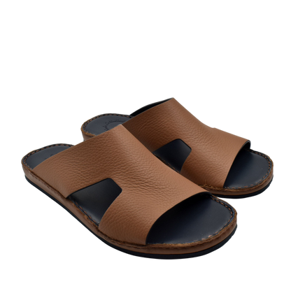 Brown Western leather sandals with open toe and black cushioned sole for comfortable wear